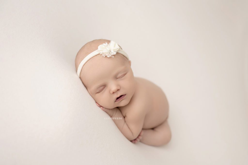 infant girl on white