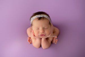 newborn girl in froggy pose