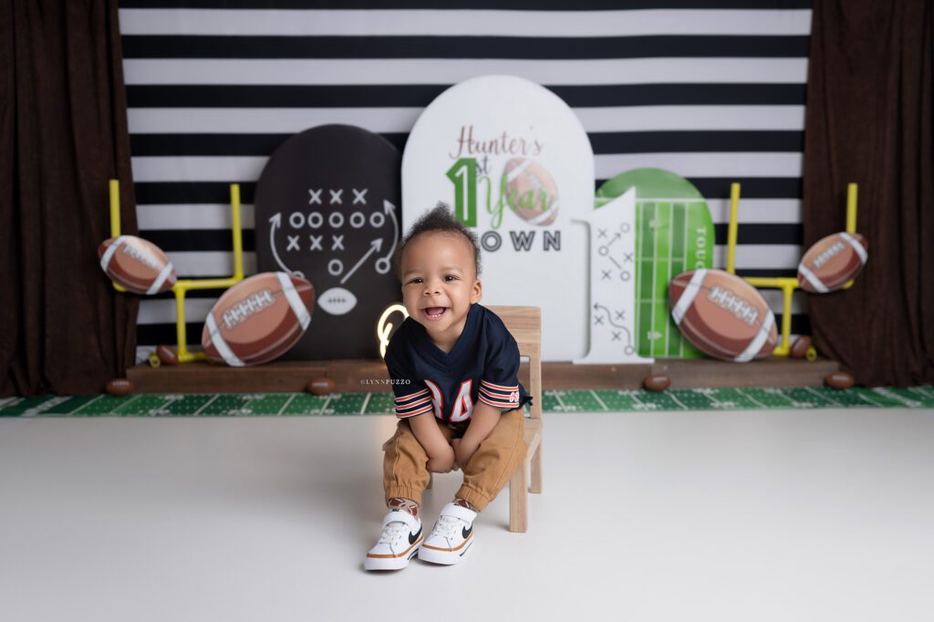 First birthday football-themed cake smash studio session