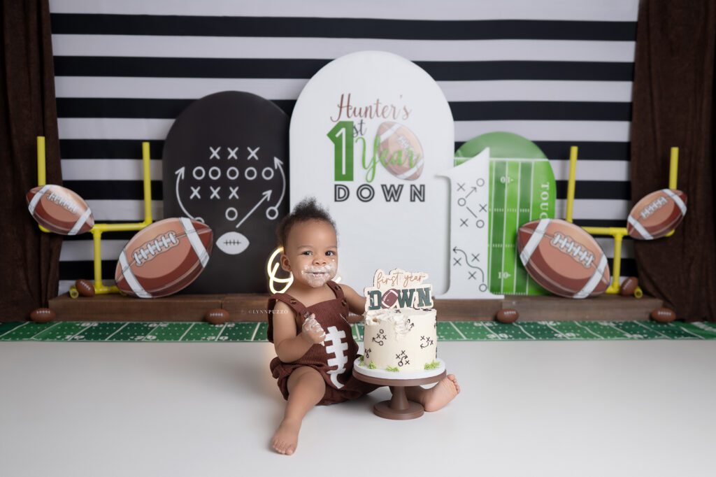 Baby boy football cake smash with custom themed cake