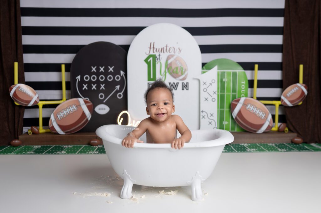 First Year Down Cake Smash bath photos with football theme