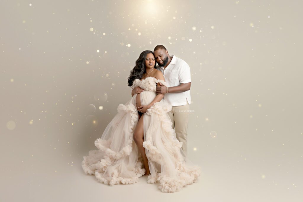 Luxury studio maternity photography showcasing couple maternity portraits
