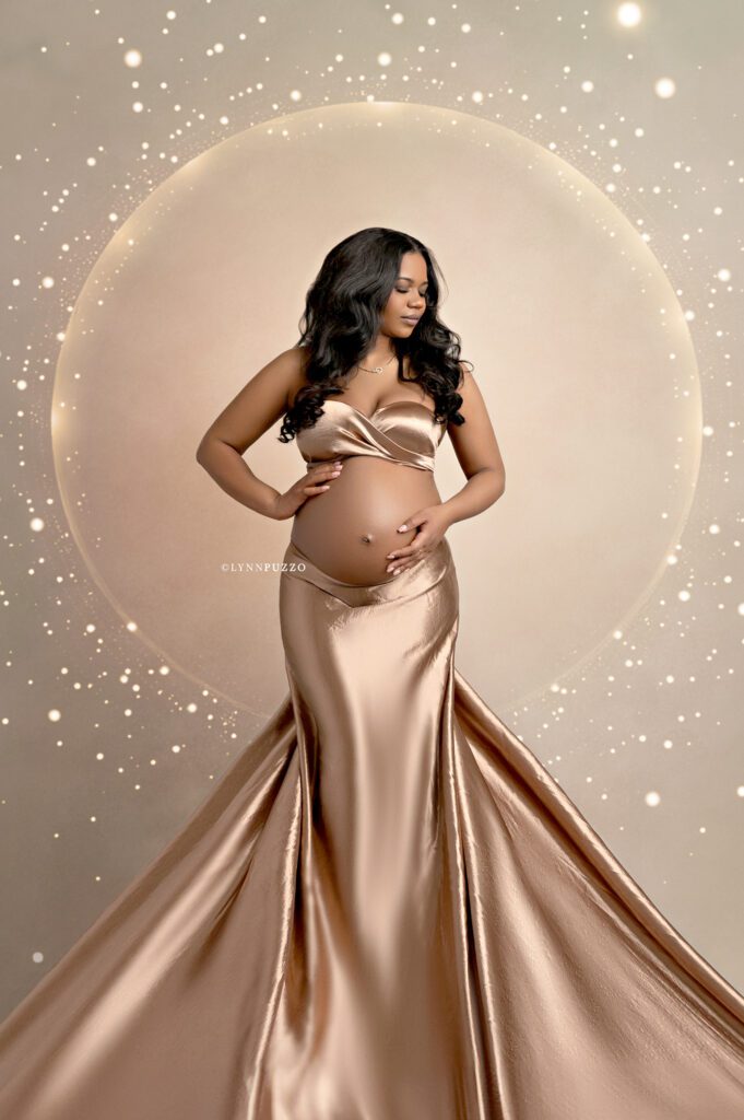 Luxury studio maternity photography with metallic brown fabric