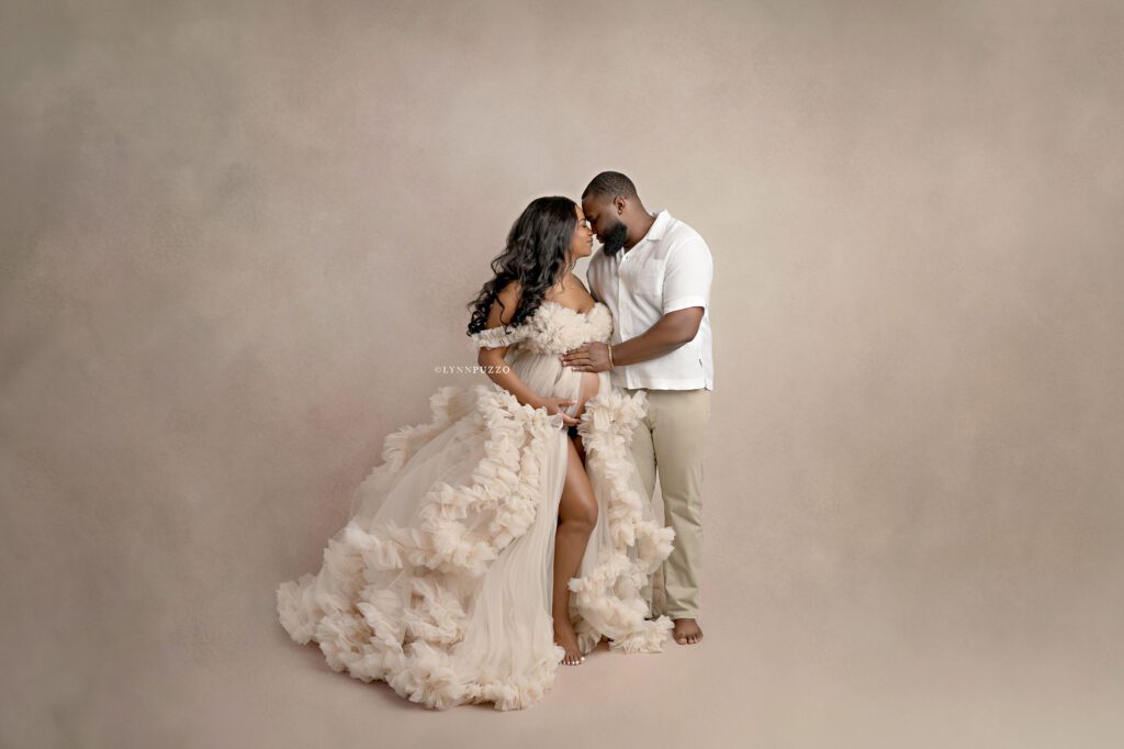 Luxury studio maternity photography showcasing couple maternity portraits