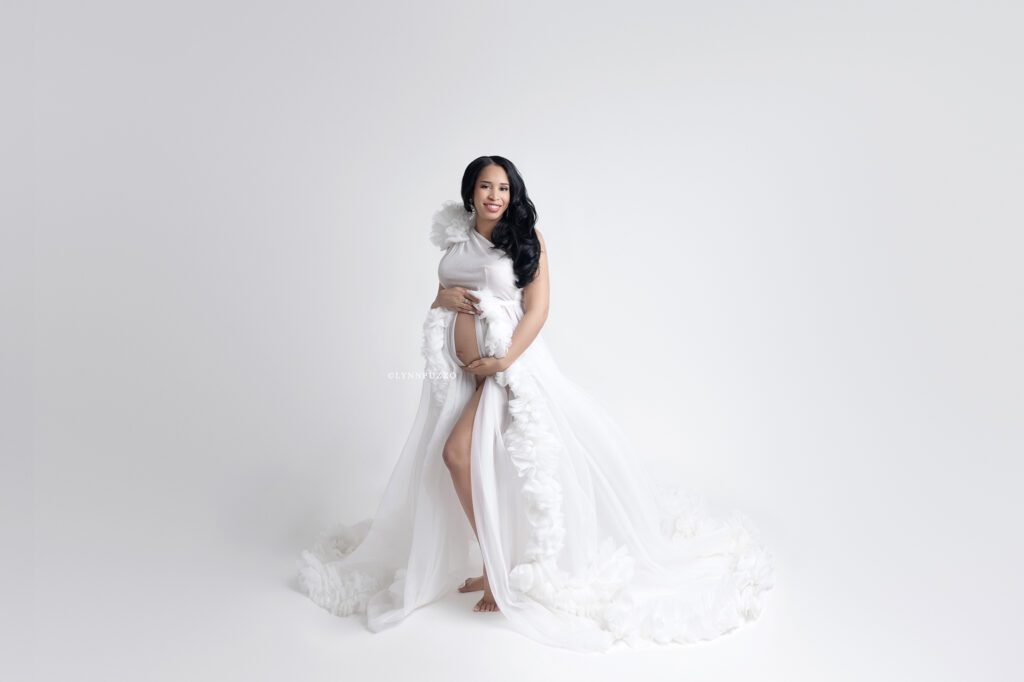 Fine art white maternity dress studio session