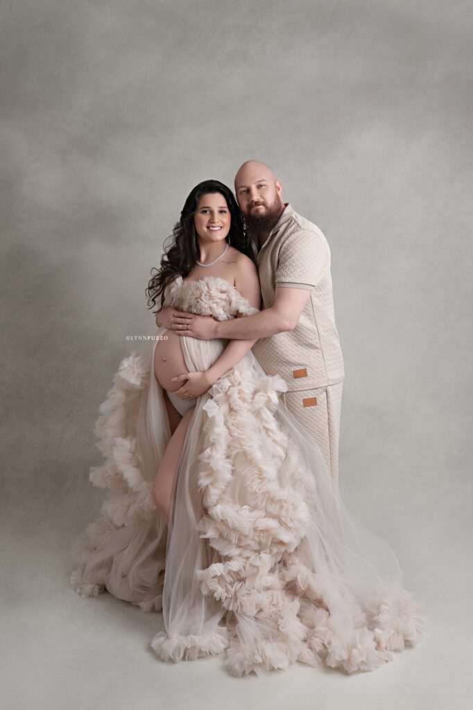 Romantic maternity photo of couple embracing with baby bump, south atlanta maternity photography session