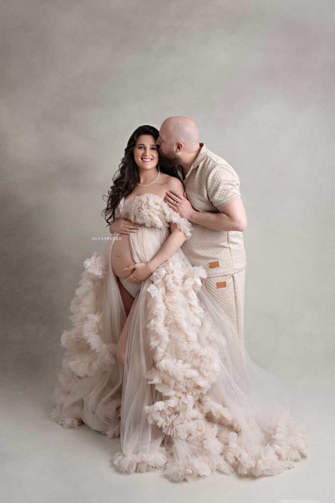 Romantic maternity photo of couple embracing with baby bump, south atlanta maternity photography session