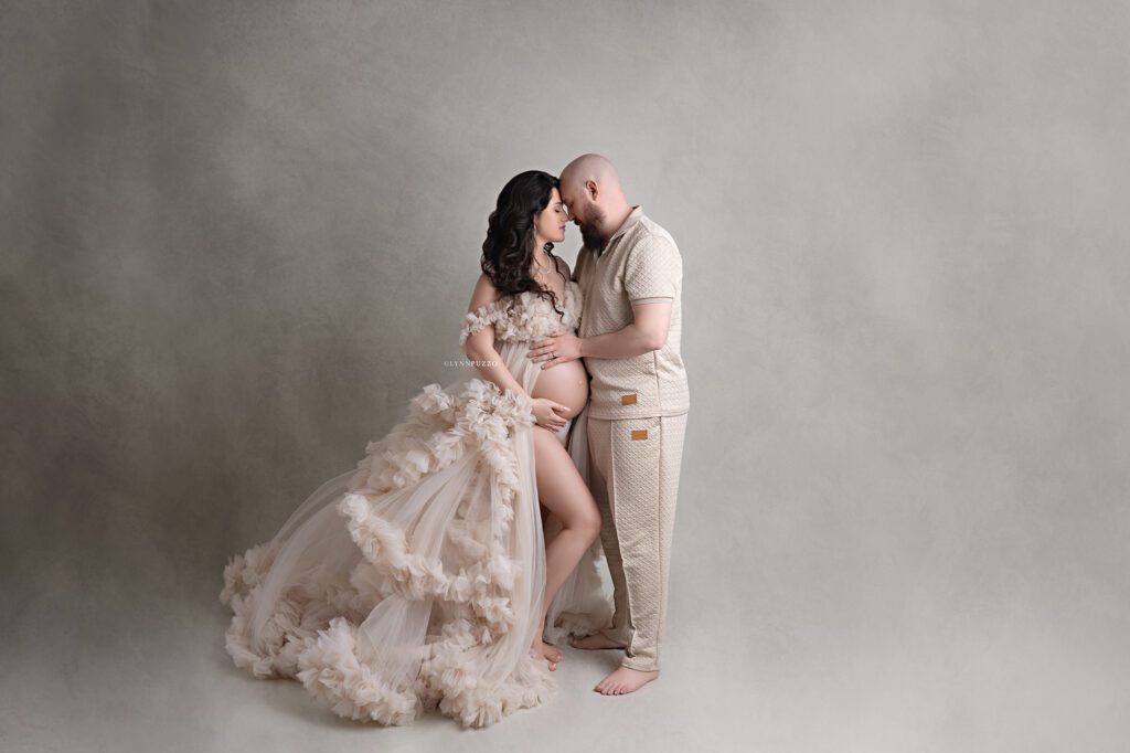 Romantic maternity photo of couple embracing with baby bump, south atlanta maternity photography session